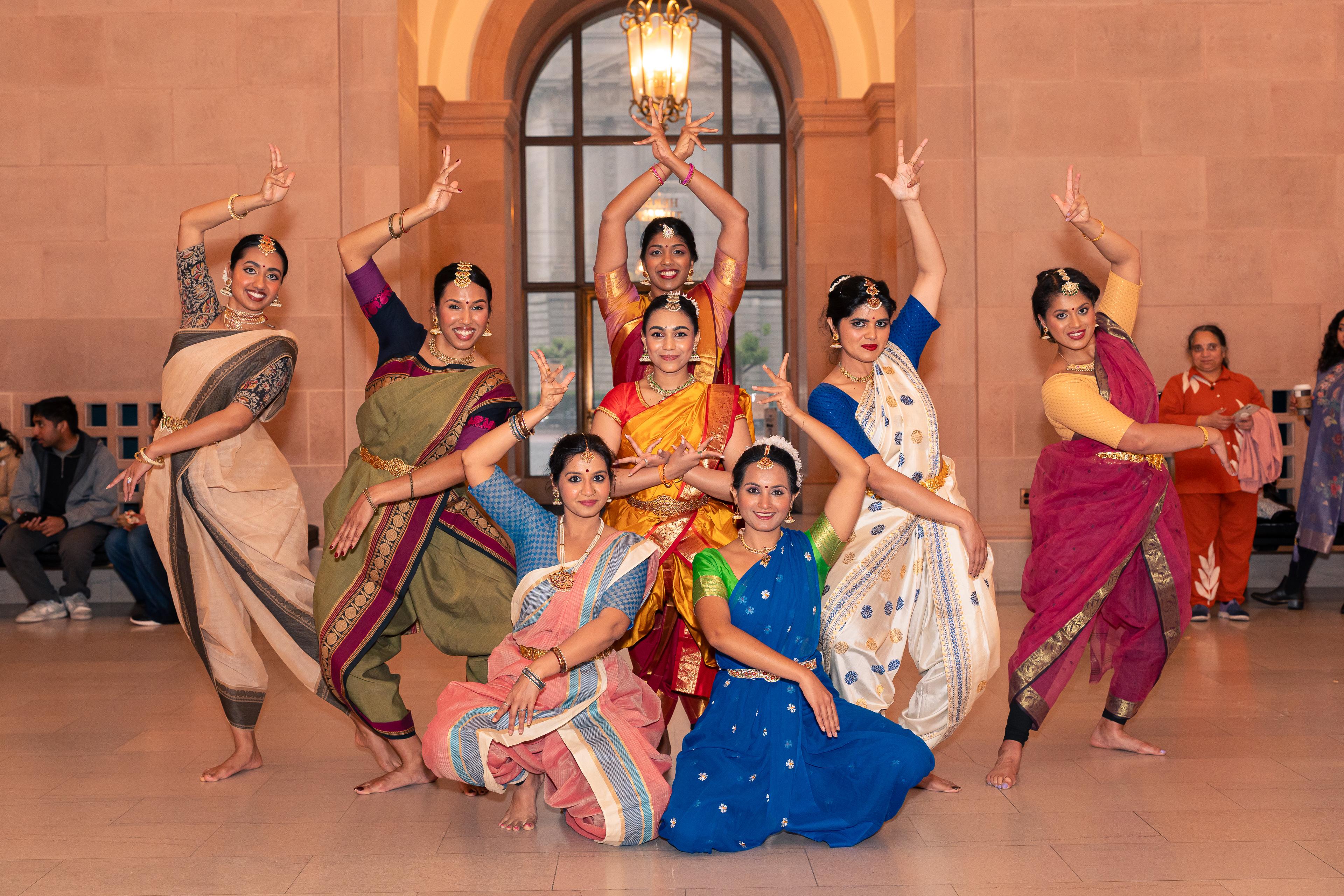 SF Adavu community members smiling during a photoshoot break